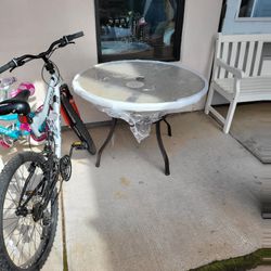 New patio table $39 24" by $100 26" bike $125
