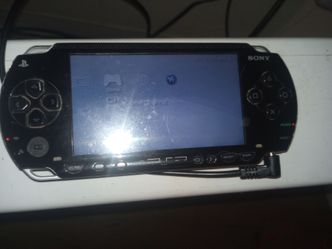 PlayStation Portable PSP 1001 with battery and charger