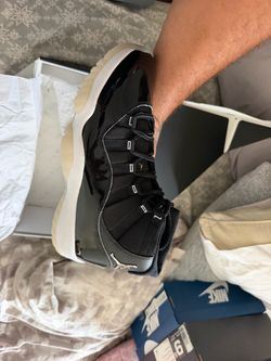 Air Jordan 11 Black Patent Leather Sneakers