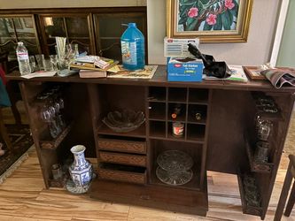 This wooden hand carved Asian bar falls in and out don’t need much space for lotta places to put glass glasses and booze price to sell
