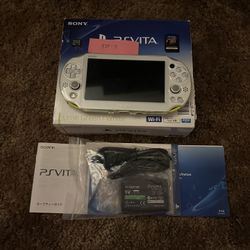 PlayStation Vita 2000 yellow with box and accessories