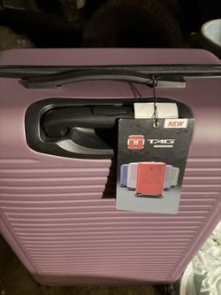 NEW ( has been stored) TAG TRAVEL LUGGAGE