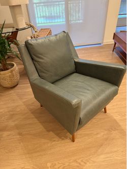 2 west elm leather chairs