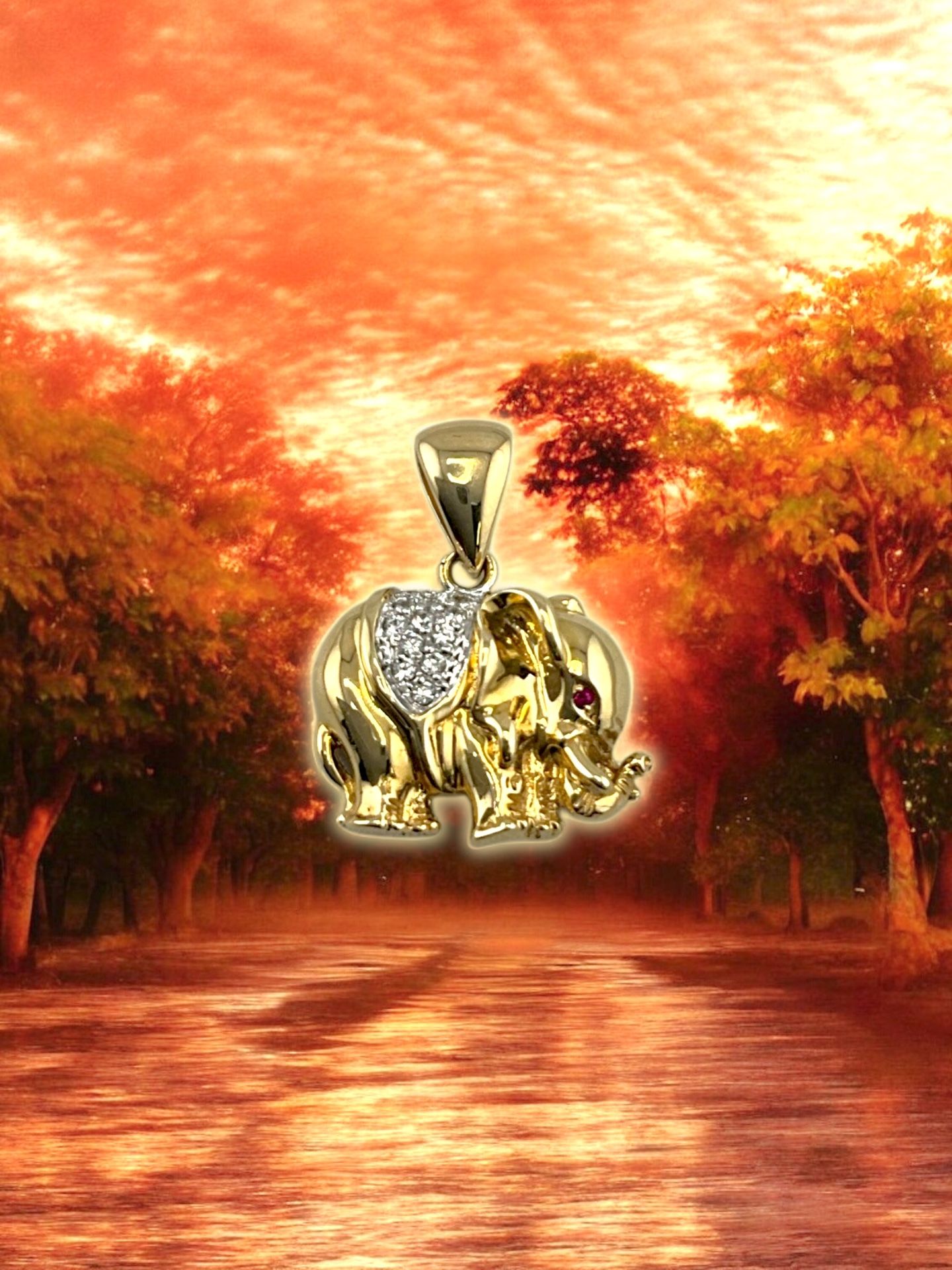 14kt 5.50g Yellow Gold with Small CZ’s/Small Red Stones Elephant Pendant.