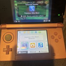 Pink Nintendo 3DS with Pokemon Ultra Moon