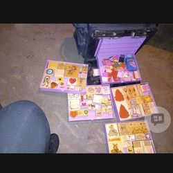 Stamps collection with the drawers and carry on bag.