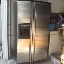 KitchenAid stainless steel side-by-side fridge with ice/water in the door