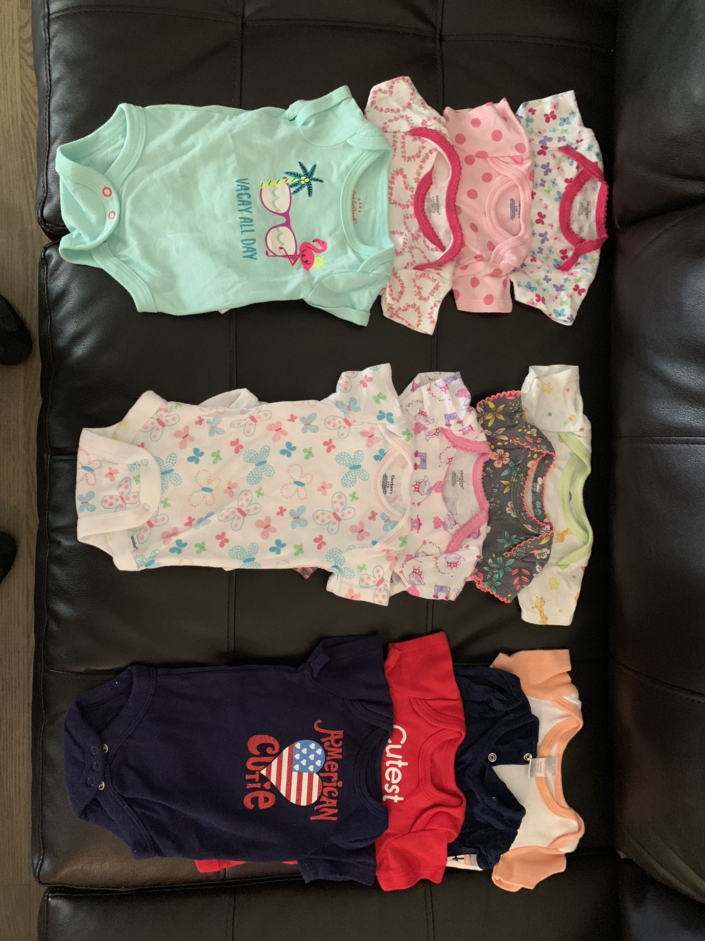 Lightly worn baby girl clothes. Onesies, sleepers, sweaters, dresses, and shoes. Clothes sizes 0-12 months and shoes sizes 1 & 2.