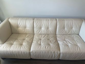$150 – Cream Leather Sofa + Ottoman