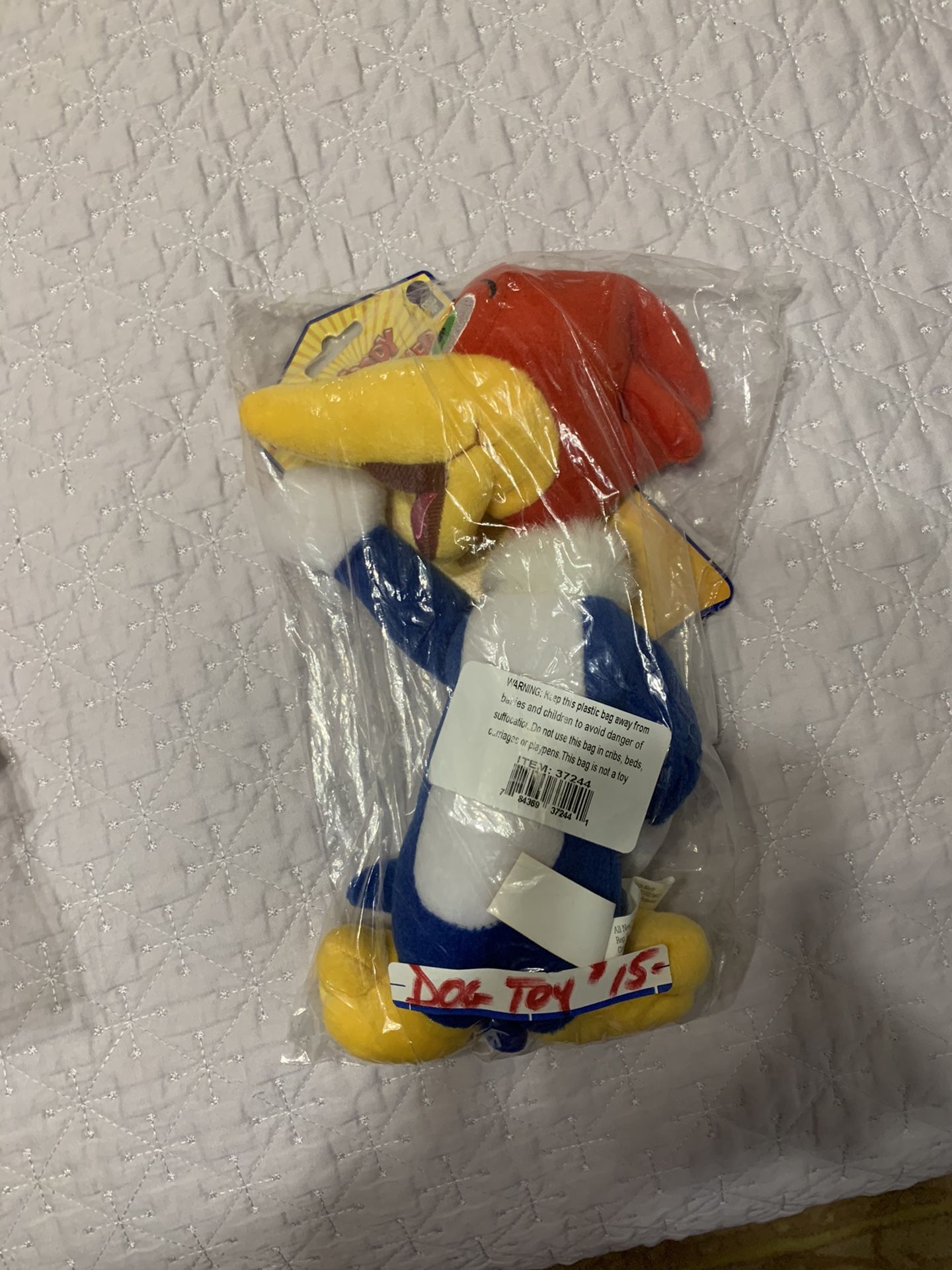 Brand new dog toy in original packaging. “Woody woodpecker”