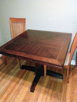 solid wood table with four chairs extendable