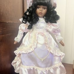 Beautiful Doll In A Pink Dress With Curly Hair