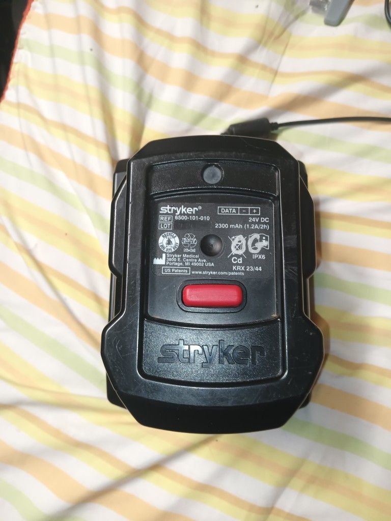 Stryker battery charger with power adapter.