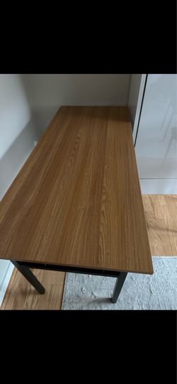 55 inch w 24 inch D and 29 inch tall Desk/table
