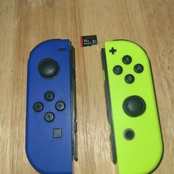 Nintendo switch joy cons and 32 gb memory card.