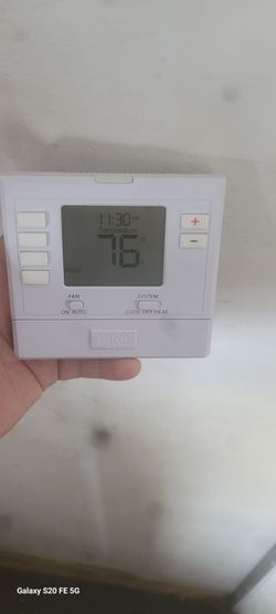 Thermostat for heat and air conditioner