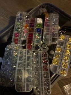 Different stuff and designs for your fingernails you can do. I got a whole bag of different stuff the charms, the nails. Different stuff and designs f