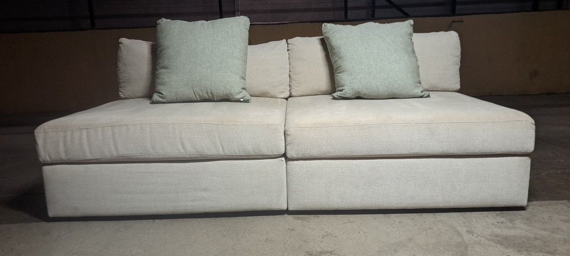 Living Spaces 2 Piece Armless Modular Sofa.