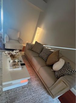Beige Upholstered Sofa with Throw Pillows