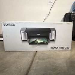 Canon PIXMA PRO-100 Inkjet Color Photo Printer with paper