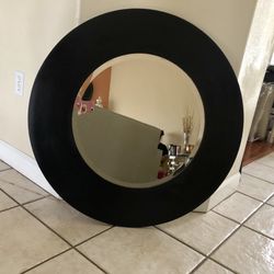 Black circular mirror