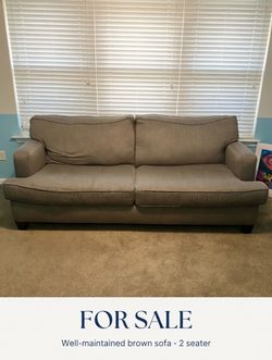 Brown two seater couch
