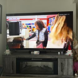 LG 85” TV + TV Stand with LED Lights, Sound & Heater