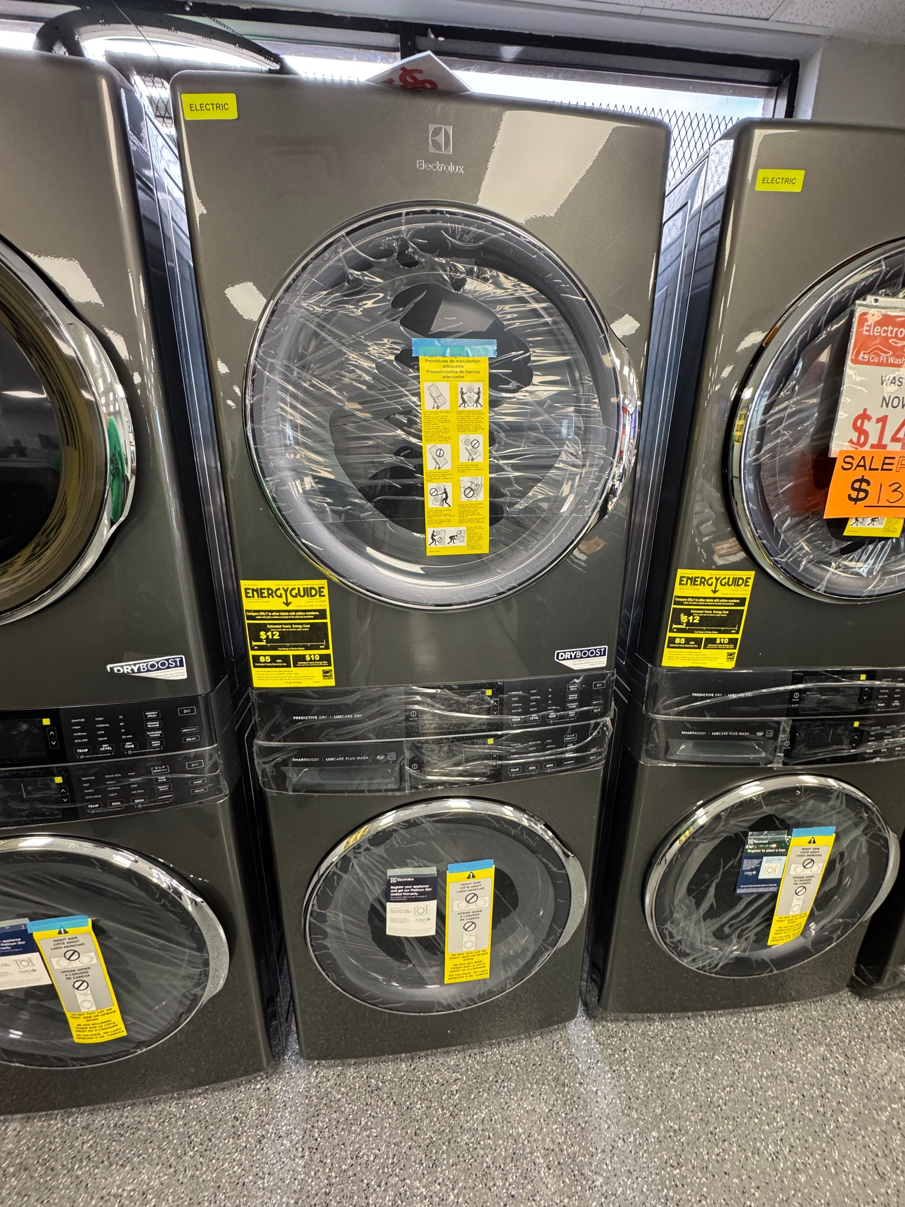 Graphite Electrolux Washer 4.5 cu ft and 8.0 cu ft Electric Dryer Stacked Set. Units are new open box scratch and dent