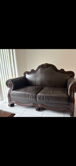 Dark Brown Leather Loveseat with Carved Wood Frame