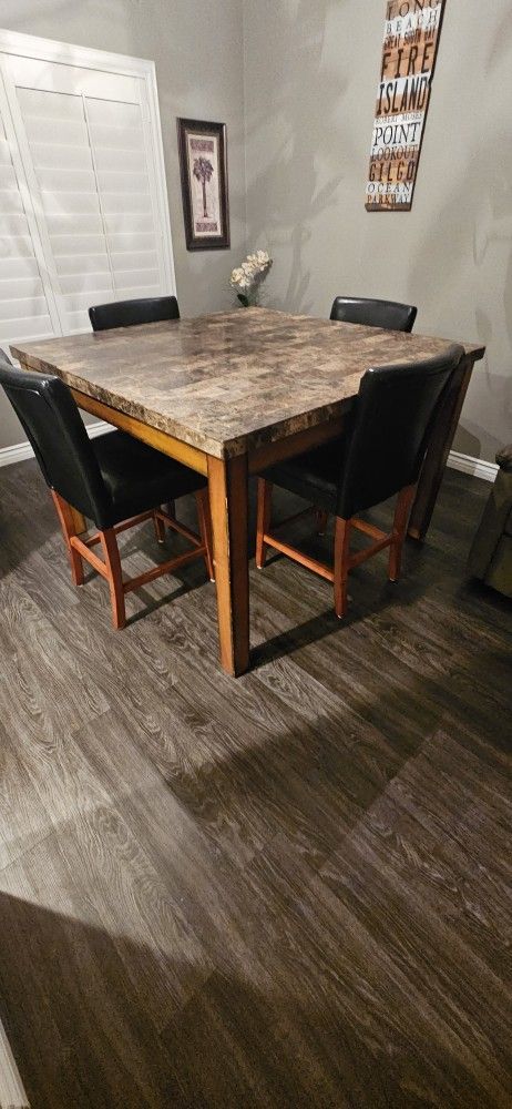 Square Marble Table With 4 one year old chairs