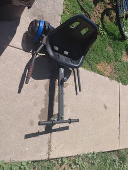 Hoverboard with seat attachment assembly already attached to board.