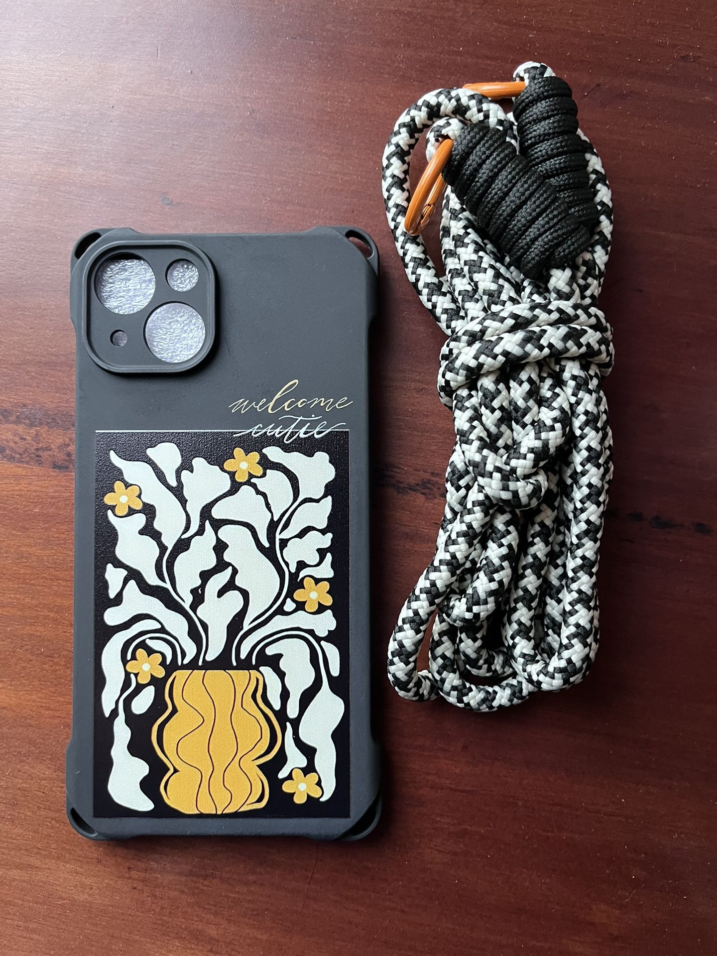 Hanging Rope Protective IPhone Case with floral design.