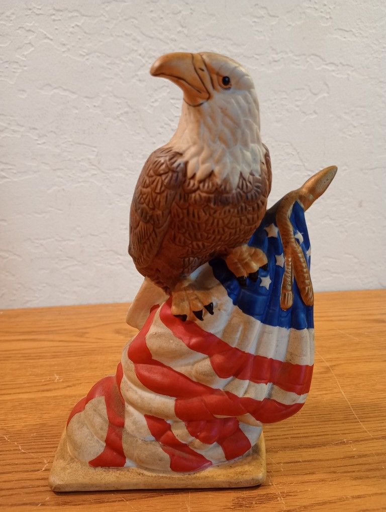 American Bald Eagle Perched On US Flag Pole 