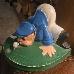 Vintage cast iron golfer door stop