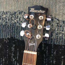 Maestco By Gibson , six string acoustic guitar