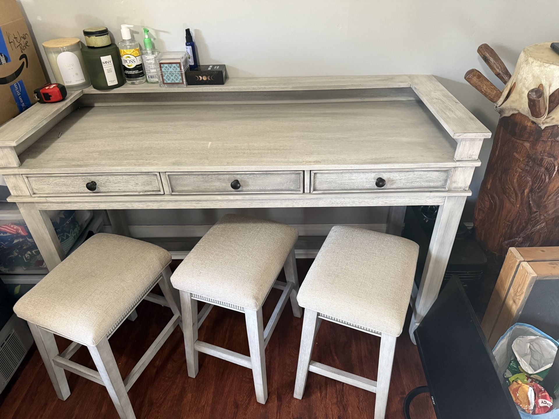 light grey desk/work table/bar with 3 stools