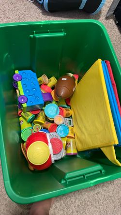 Tub of play-Doh with some holders