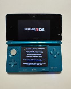 Aqua blue Nintendo 3DS with 688 games