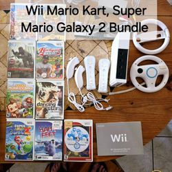 Wii Mario Kart Bundle. 2 Racing Wheels, Console, 2 Controllers,  2 NEW Nunchucks, Mario Galaxy 2 game. 9 Game Lot 