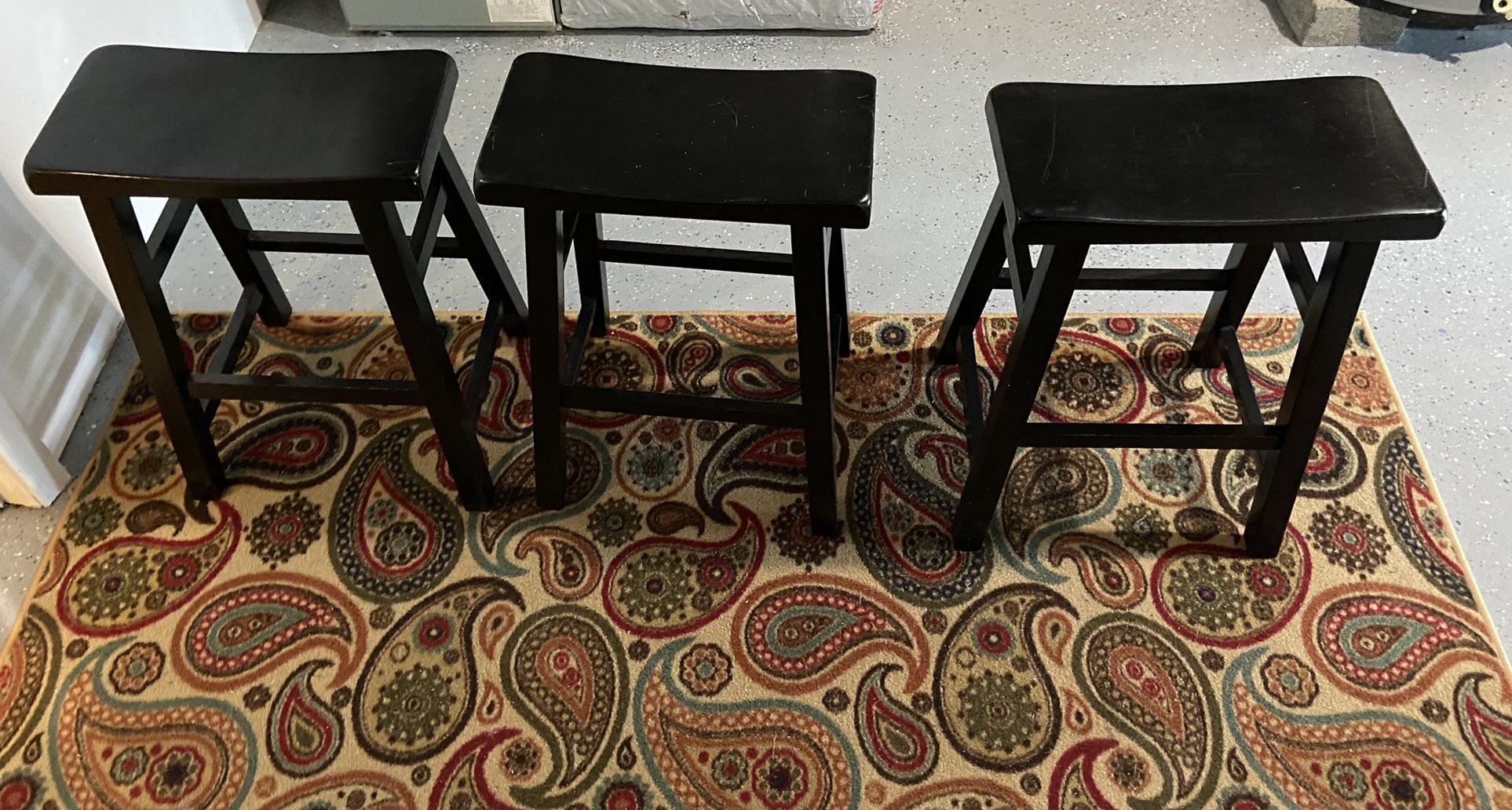 3 Black Counter-Height Saddle Stools