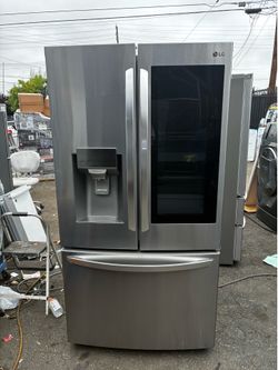 Gray LG three-door stainless steel refrigerator