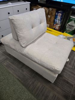 Beige Tufted Armless Accent Chair. 45×30×16 in
