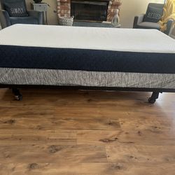 Twin size bed frame with memory foam mattress and box spring