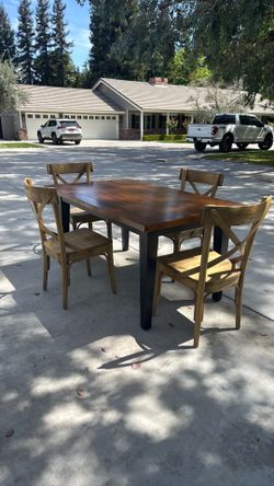 Wooden table with four chairs