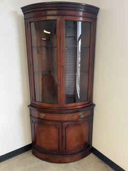 Drexel Curved. Glass Corner Cabinet