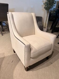 Cream Upholstered Accent Chair with Nailhead Trim