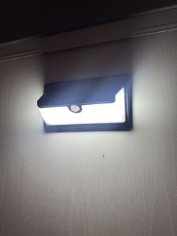 LED lamp with motion sensor and solar panel