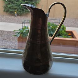 Antique hammered copper pitcher