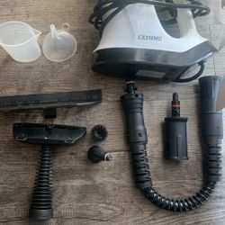CXYHMG handheld garment steamer with various attachments.  