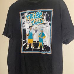 vintage Tribe Zulu Gear t-shirt, a hip-hop streetwear brand that was popular in the 1990s The shirt features a graphic of two people on a basketball c